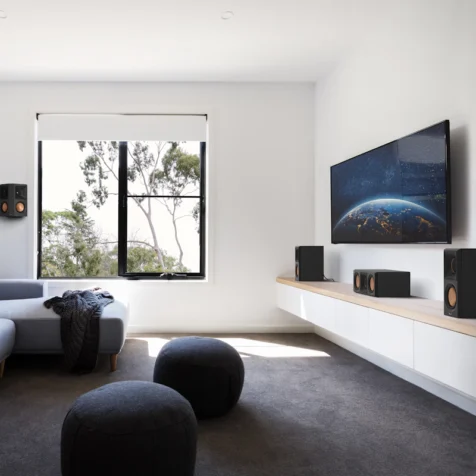 RP-500C-II-sitting-on-a-white-and-wood-colored-credenza-under-a-TV-in-front-of-some-interesting-furniture